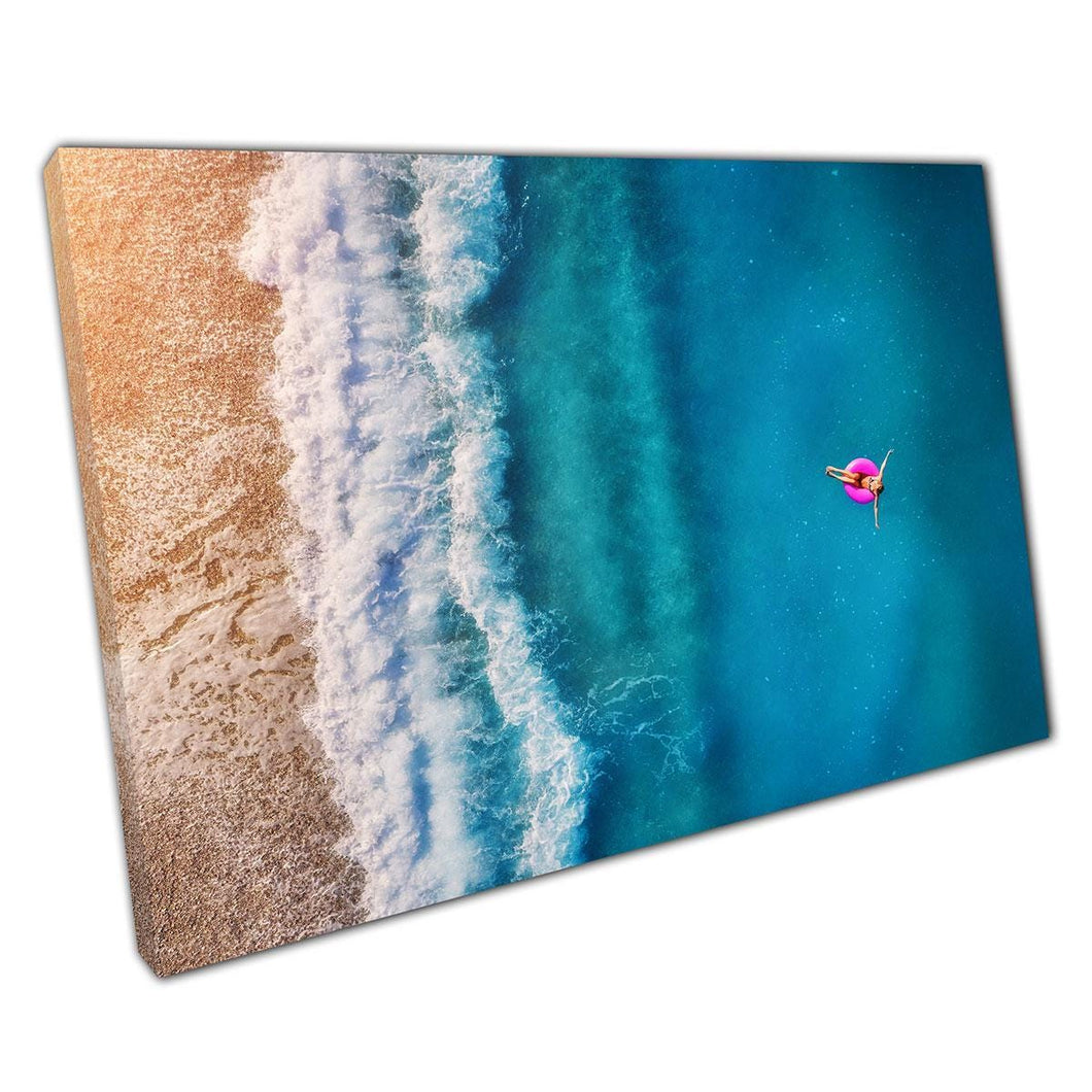Aerial Beach Paradise: Woman by Clear Blue Ocean Canvas Print - Coastal Wall Art for Home & Office - Print Store